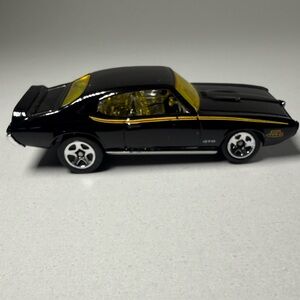 Hot Wheels ‘69 Pontiac GTO. Black w Yellow tint glass Die-Cast 1:64